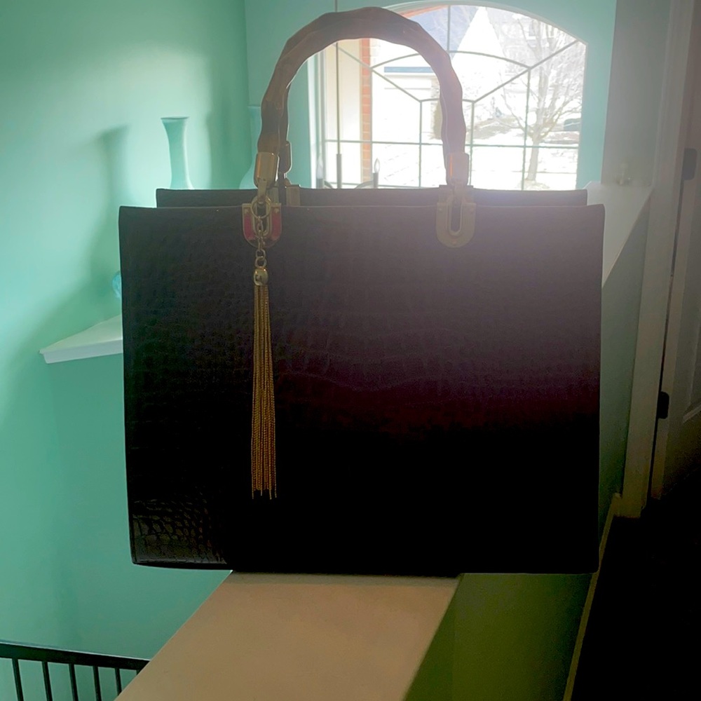 Burgundy purse with many storage compartments